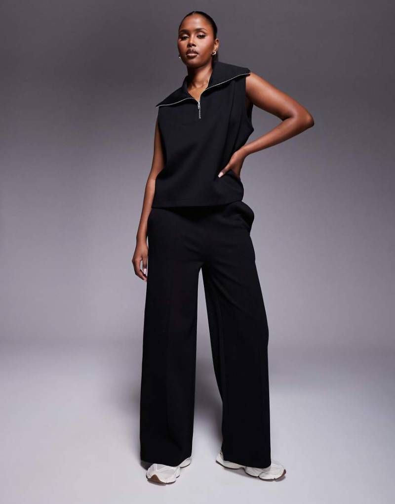 ASOS DESIGN - Jogginghose aus Interlock-Stoff in Schwarz mit weitem Bein, Kombiteil von ASOS DESIGN