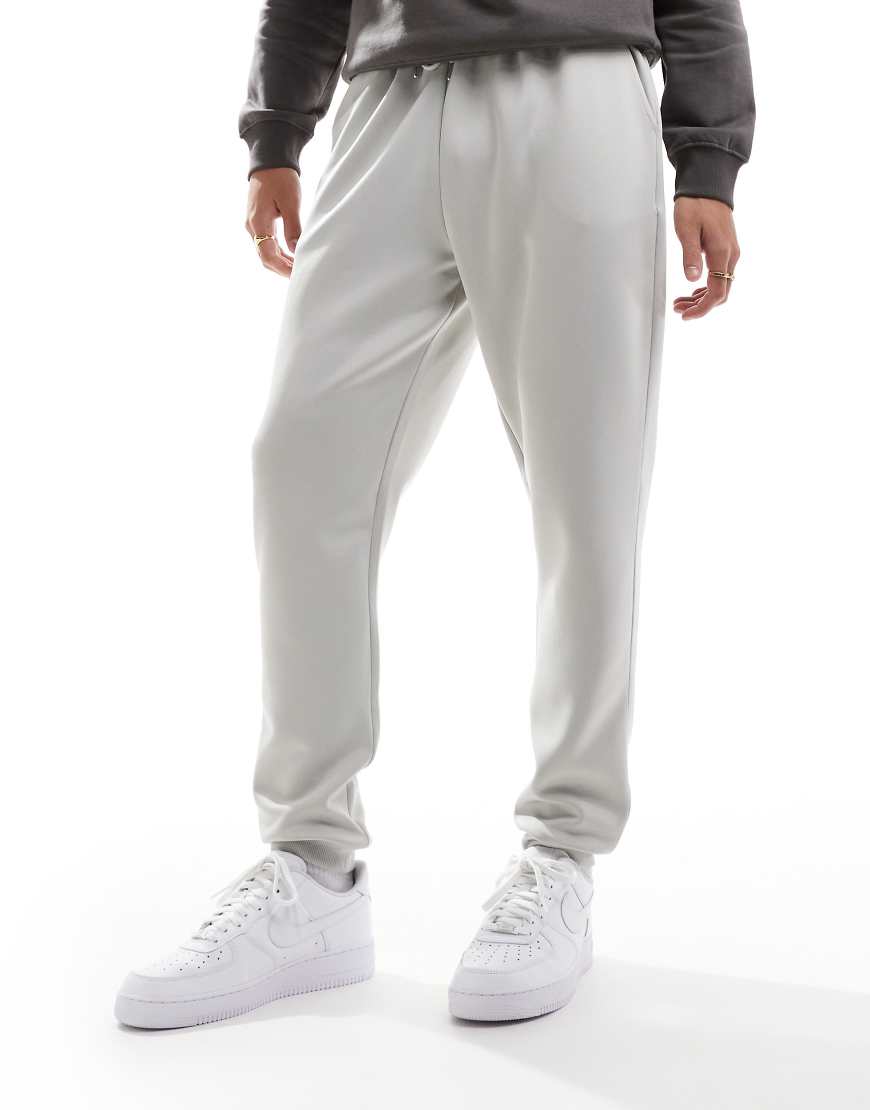 ASOS DESIGN - Jogginghose aus schwerem, neoprenartigem Material in Grau mit engem Schnitt von ASOS DESIGN
