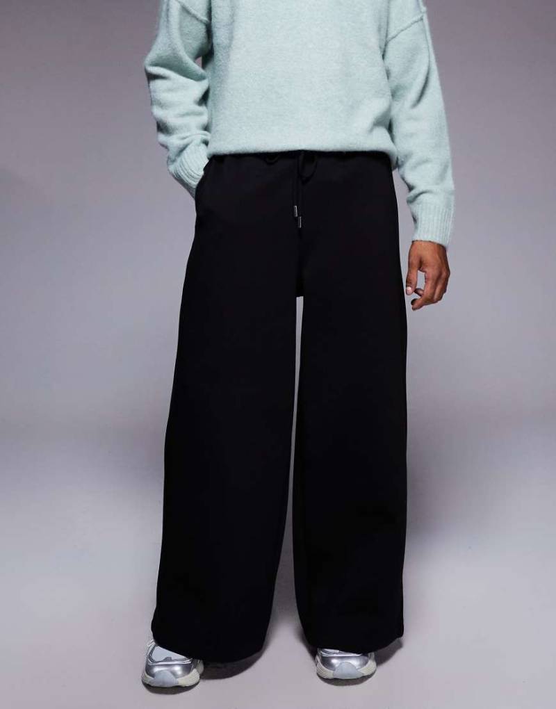 ASOS DESIGN - Jogginghose aus schwerem neoprenartigem Material in Schwarz mit superweitem Bein von ASOS DESIGN