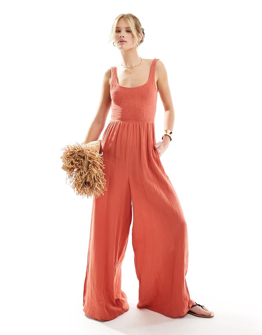 ASOS DESIGN - Jumpsuit in Rost mit U-Ausschnitt und weitem Bein-Kupfer ASOS DESIGN - Jumpsuit in Rost mit U-Ausschnitt und weitem Bein-Kupfer von ASOS DESIGN