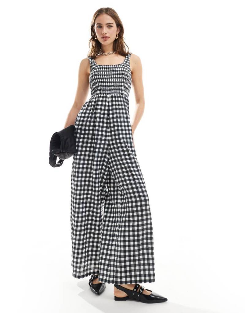 ASOS DESIGN - Jumpsuit mit Vichykaromuster in Schwarz-Weiß, U-Boot-Ausschnitt und weitem Bein-Bunt von ASOS DESIGN