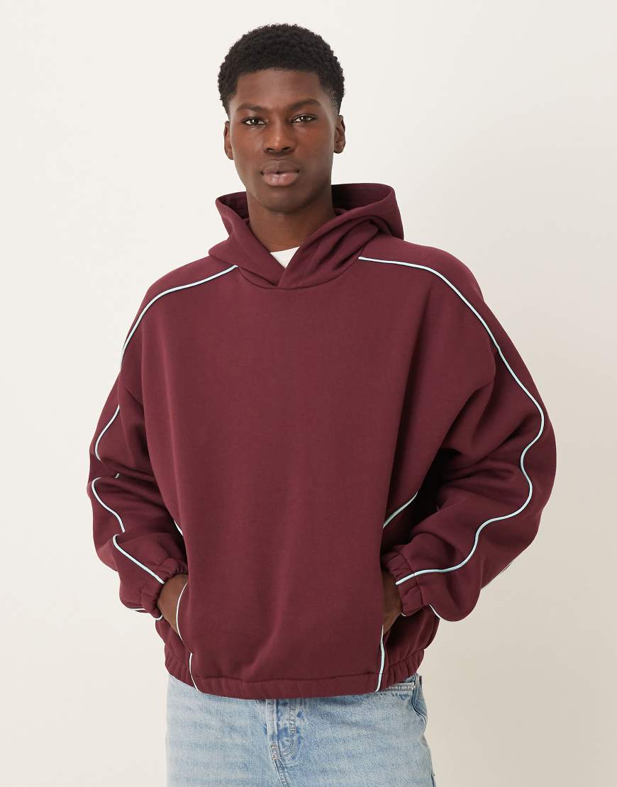 ASOS DESIGN - Kapuzenpullover in Burgunderrot mit extremer Oversize-Passform und Paspelierung von ASOS DESIGN