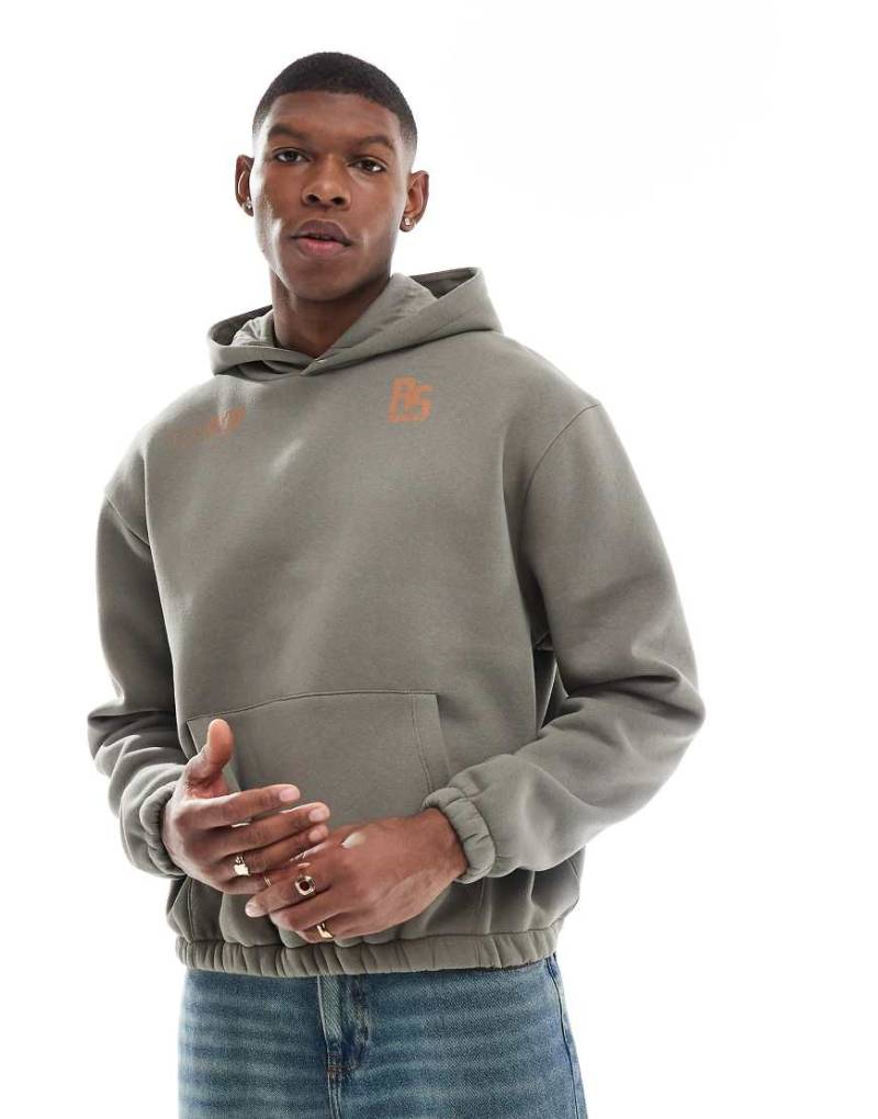 ASOS DESIGN - Kapuzenpullover in Khaki mit kastigem Schnitt und Print-Grün von ASOS DESIGN
