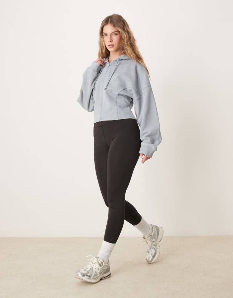 ASOS DESIGN - Kapuzenpullover in verwaschenem Blau mit Ziernähten und durchgehendem Reißverschluss von ASOS DESIGN