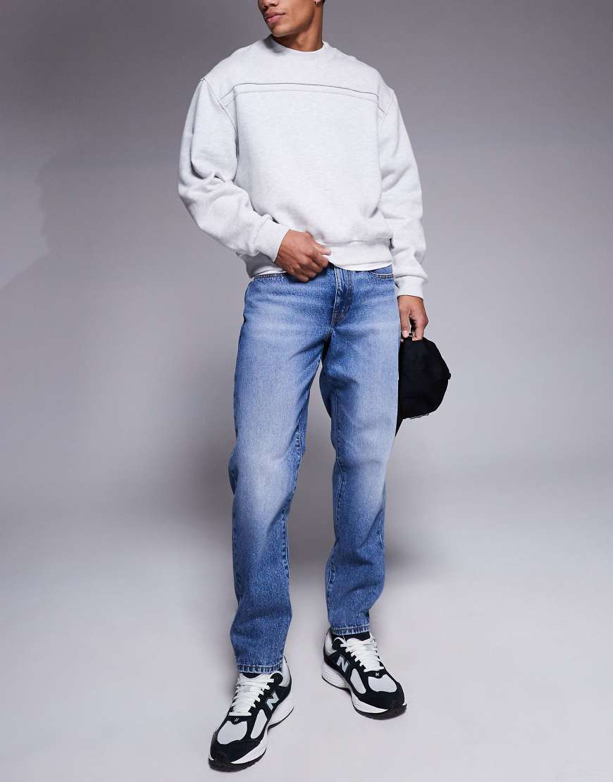 ASOS DESIGN - Karottenjeans in verwaschenem Dunkelblau von ASOS DESIGN