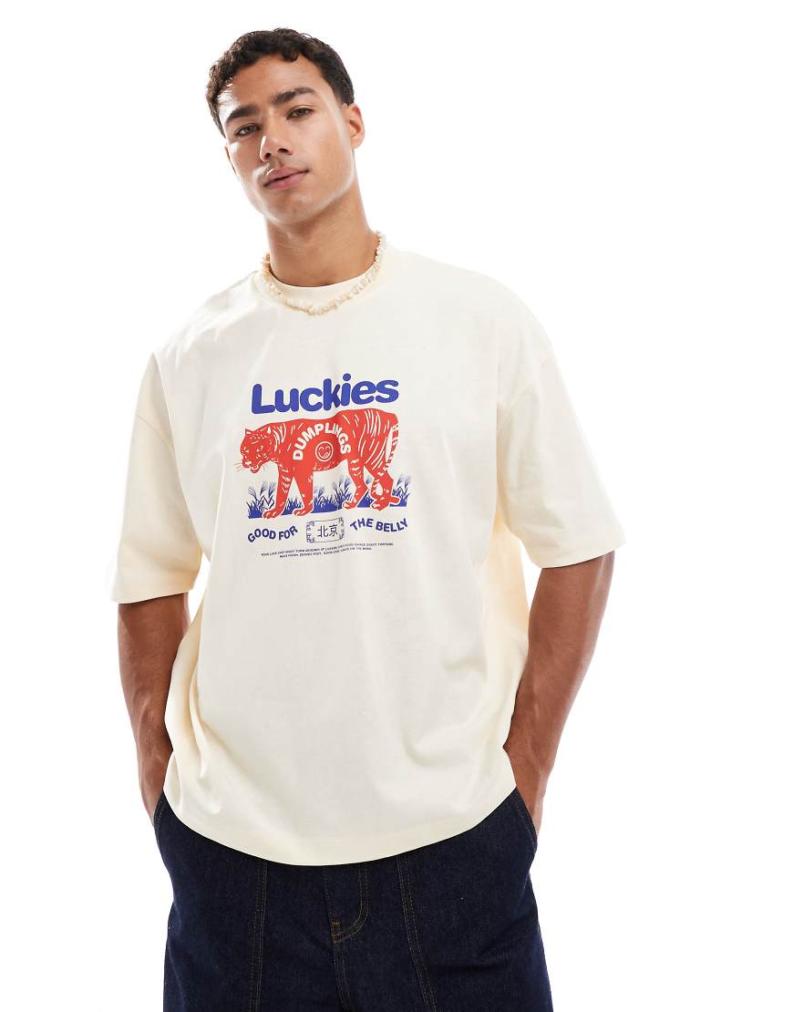 ASOS DESIGN - Kastig geschnittenes Oversize-T-Shirt in Creme mit Souvenir-Grafik-Neutral von ASOS DESIGN