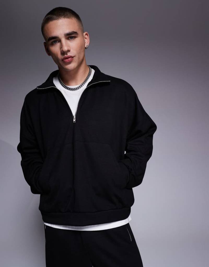 ASOS DESIGN - Kastiger Oversize-Kapuzenpullover in Schwarz mit Stehkragen, Reißverschluss und überschnittenen Schultern, Kombiteil von ASOS DESIGN