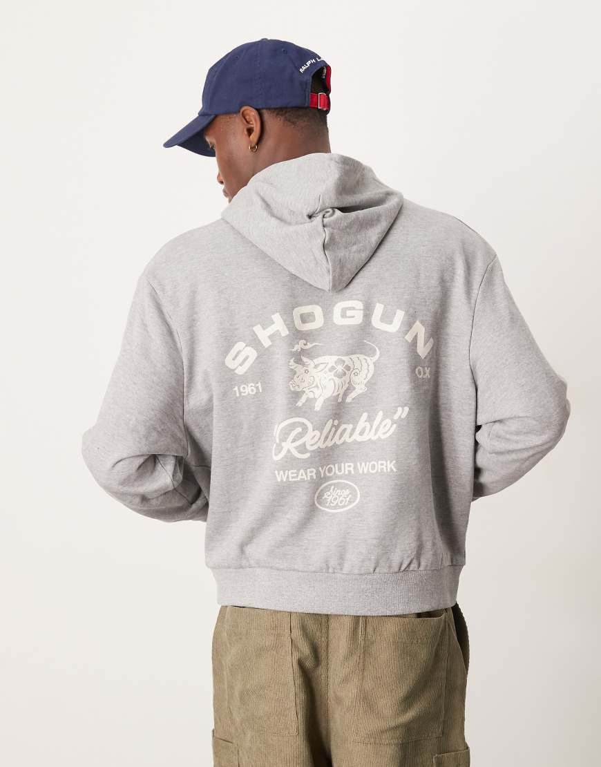 ASOS DESIGN - Kastiger Oversize-Kapuzenpullover in grau meliert mit Grafikprint im amerikanischen Stil ASOS DESIGN - Kastiger Oversize-Kapuzenpullover in grau meliert mit Grafikprint im amerikanischen Stil von ASOS DESIGN