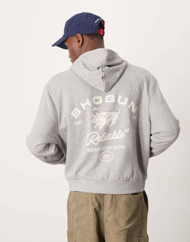 ASOS DESIGN - Kastiger Oversize-Kapuzenpullover in grau meliert mit Grafikprint im amerikanischen Stil von ASOS DESIGN