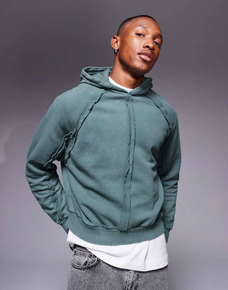 ASOS DESIGN - Kastiger Oversize-Kapuzenpullover in verwaschenem Blau mit Ziernaht von ASOS DESIGN