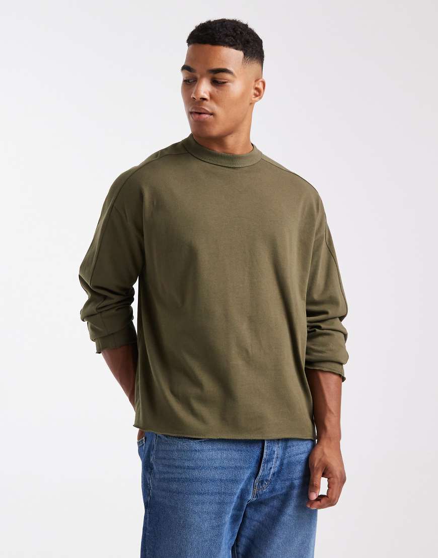 ASOS DESIGN - Kastiges, langärmliges Oversize-T-Shirt aus schwerem Stoff in Khaki mit tiefen Armlöchern-Grün ASOS DESIGN - Kastiges, langärmliges Oversize-T-Shirt aus schwerem Stoff in Khaki mit tiefen Armlöchern-Grün von ASOS DESIGN