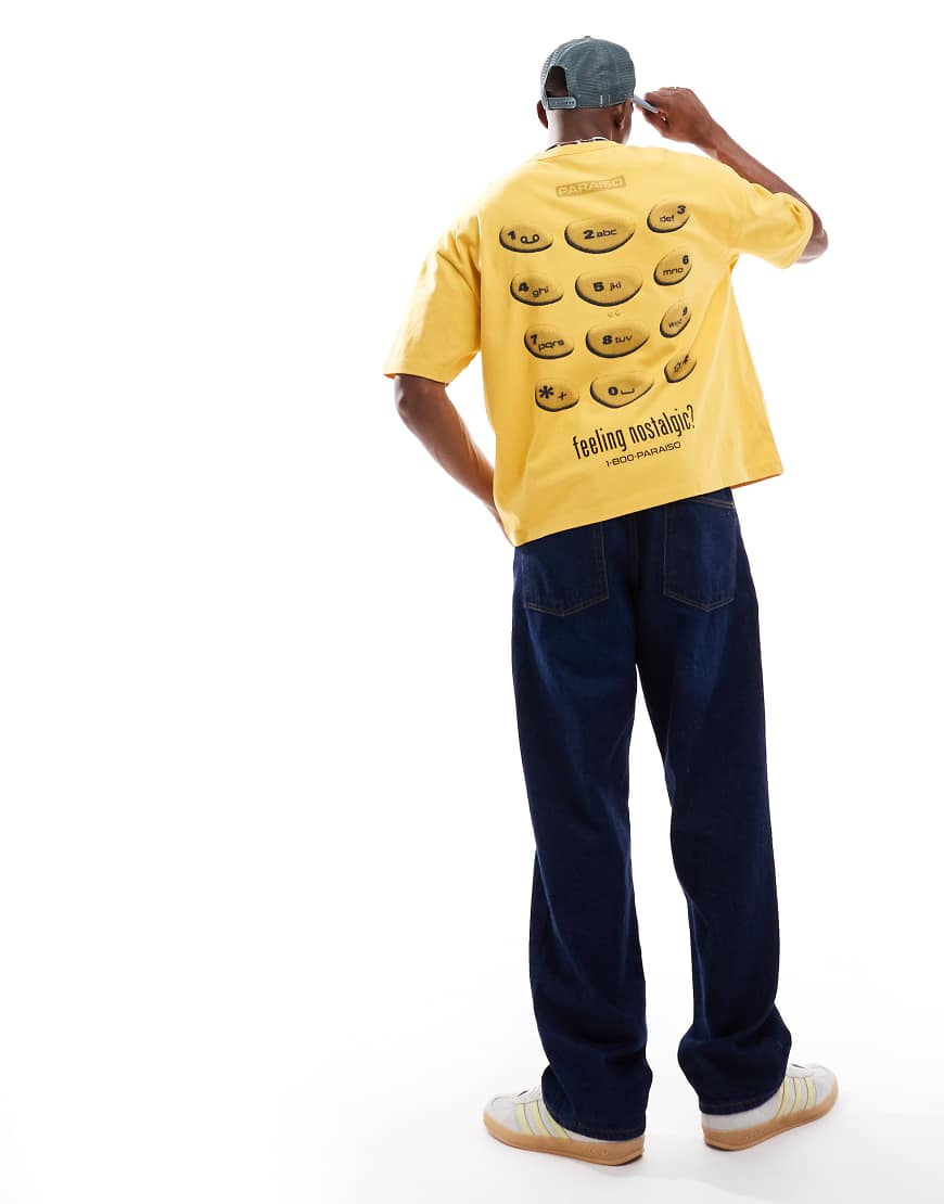 ASOS DESIGN - Kastiges, schweres Oversize-T-Shirt in verwaschenem Gelb mit nostalgischem Telefon-Print, 220 g/m² von ASOS DESIGN