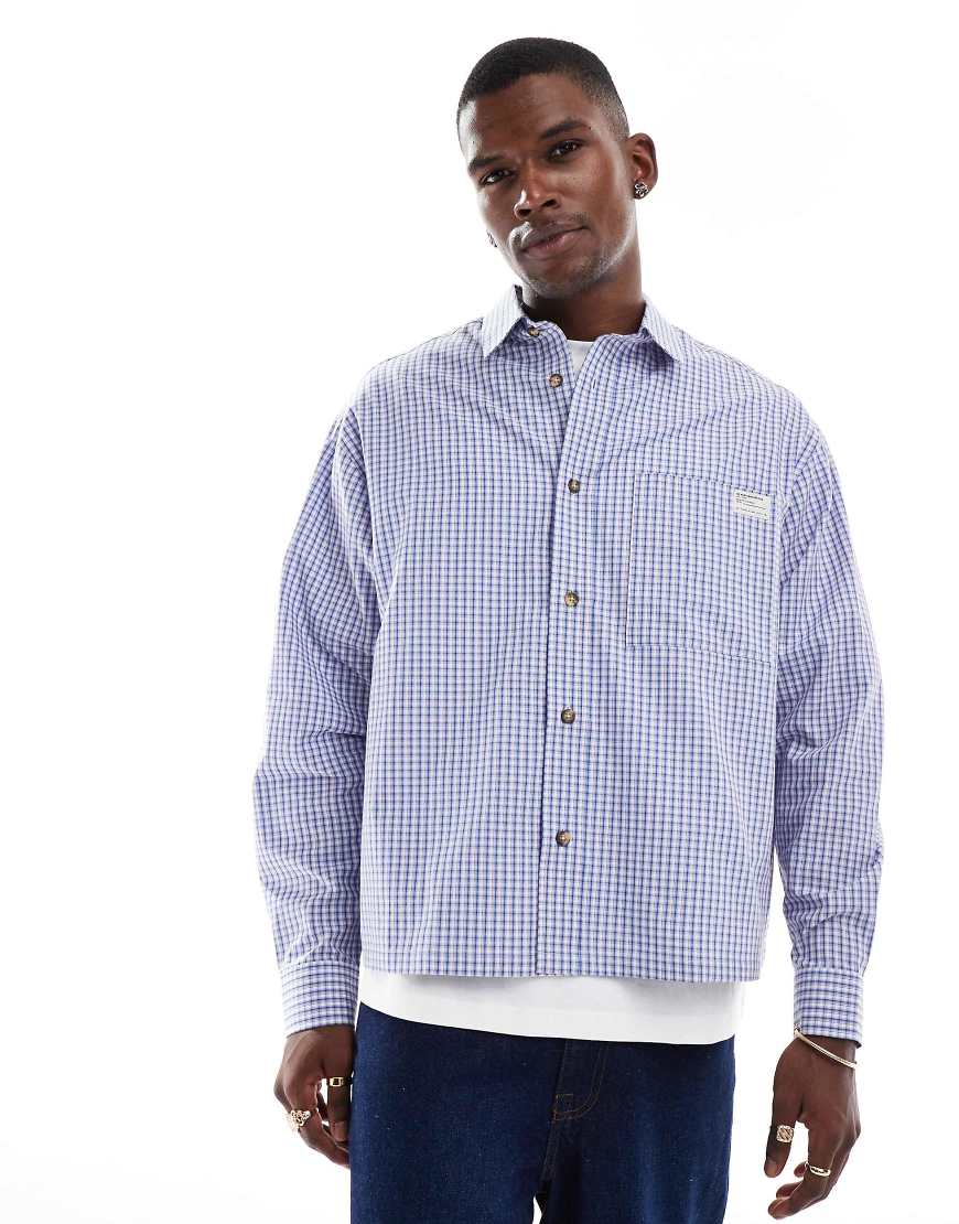 ASOS DESIGN - Kastiges Oversize-Hemd in Blau kariert mit aufgenähtem Etikett-Schwarz ASOS DESIGN - Kastiges Oversize-Hemd in Blau kariert mit aufgenähtem Etikett-Schwarz von ASOS DESIGN