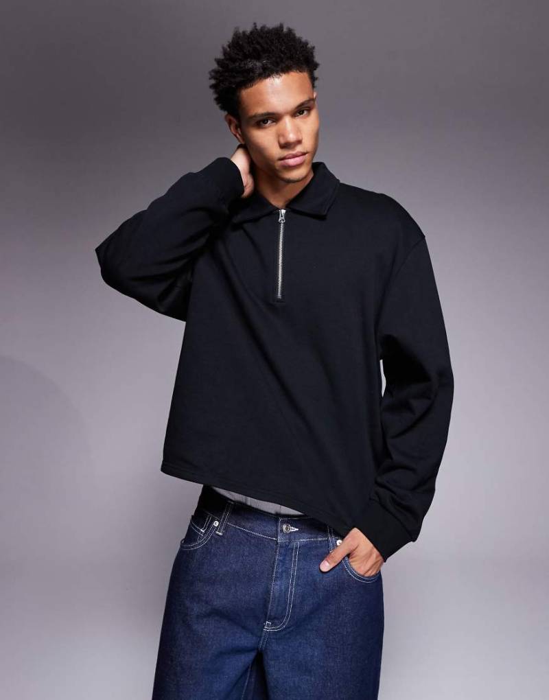 ASOS DESIGN - Kastiges, locker geschnittenes Sweatshirt in Schwarz mit kurzem Reißverschluss und Kragen von ASOS DESIGN