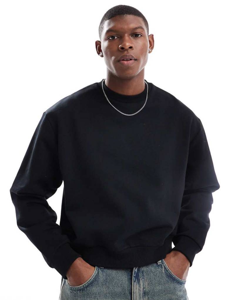 ASOS DESIGN - Kastiges Oversize-Sweatshirt in Schwarz mit überschnittener Schulter, 400 g/m² von ASOS DESIGN
