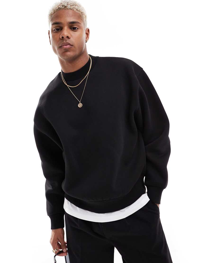 ASOS DESIGN - Kastiges Oversize-Sweatshirt in Schwarz ASOS DESIGN - Kastiges Oversize-Sweatshirt in Schwarz von ASOS DESIGN