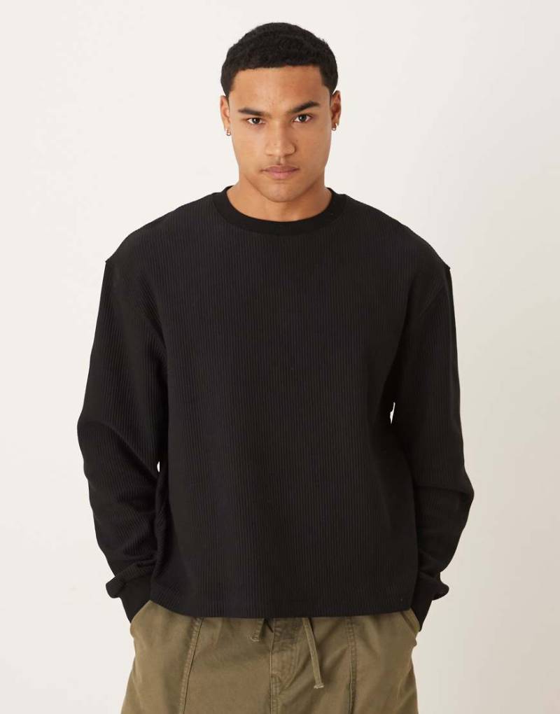 ASOS DESIGN - Kastiges Sweatshirt in Schwarz mit lockerem Schnitt und Rippenstruktur von ASOS DESIGN