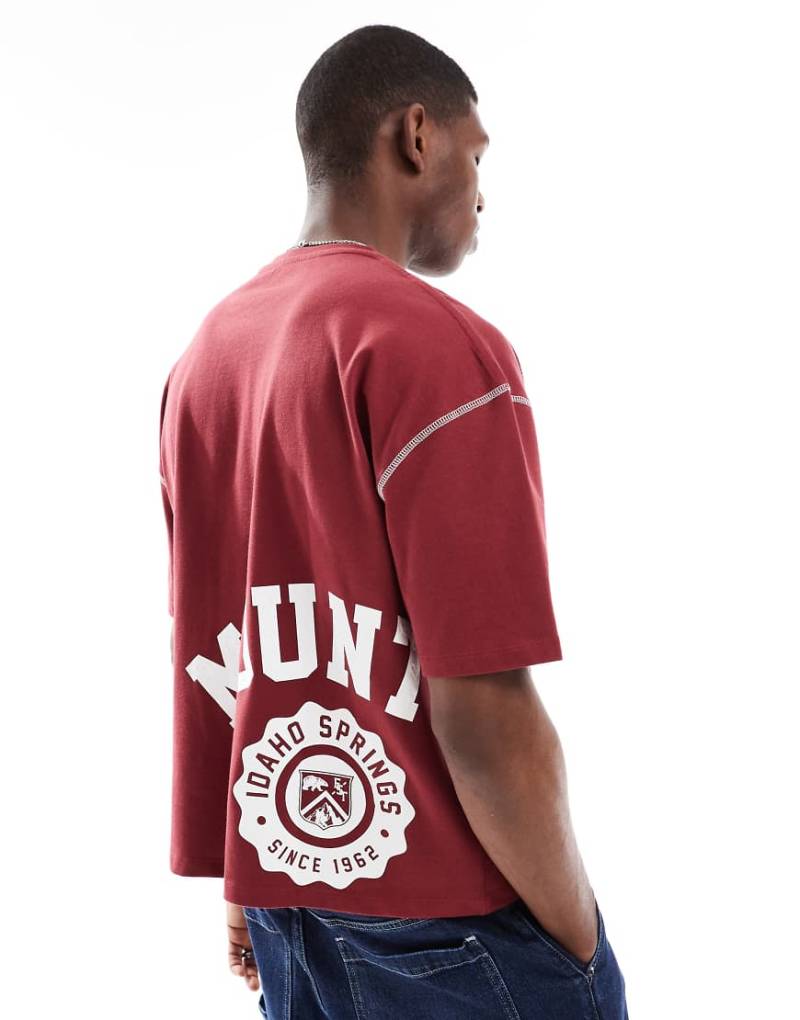 ASOS DESIGN - Kastiges Oversize-T-Shirt aus schwerem Material in Rot mit Sport-Grafikprint von ASOS DESIGN