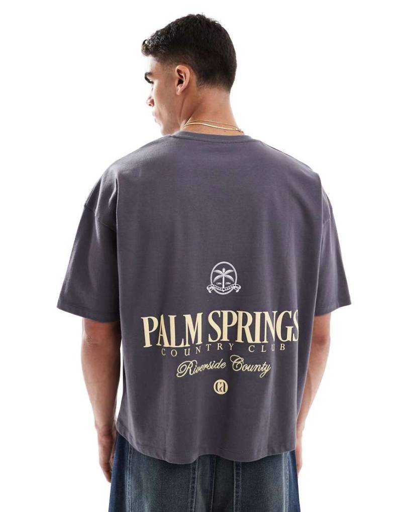 ASOS DESIGN - Kastiges Oversize-T-Shirt aus schwerem Stoff in Marineblau mit Cityprint von ASOS DESIGN