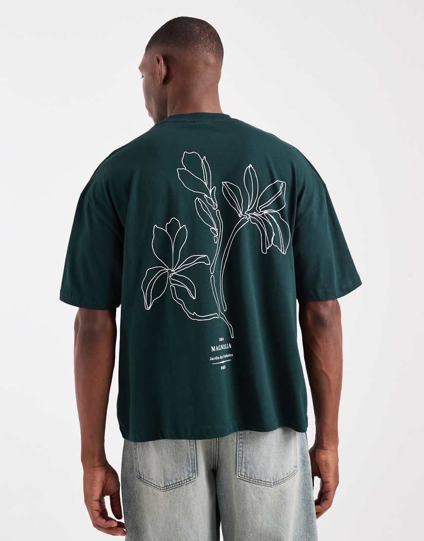 ASOS DESIGN - Kastiges Oversize-T-Shirt in Dunkelgrün mit Blumenprint am Rücken von ASOS DESIGN
