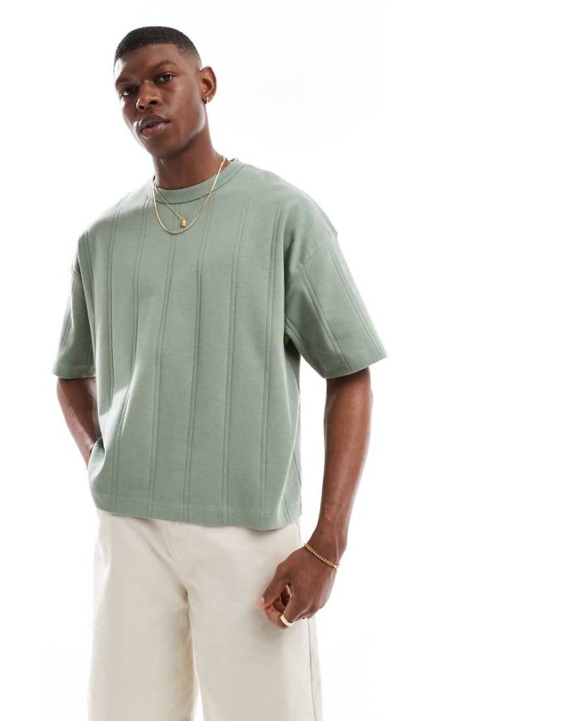 ASOS DESIGN - Kastiges Oversize-T-Shirt in Khaki mit breiter Rippenstruktur-Grün von ASOS DESIGN