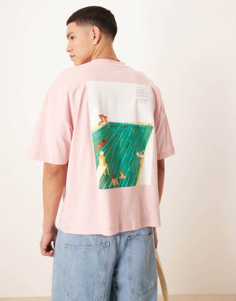 ASOS DESIGN - Kastiges Oversize-T-Shirt in Rosa mit überschnittenen Schultern und Sport-Print von ASOS DESIGN