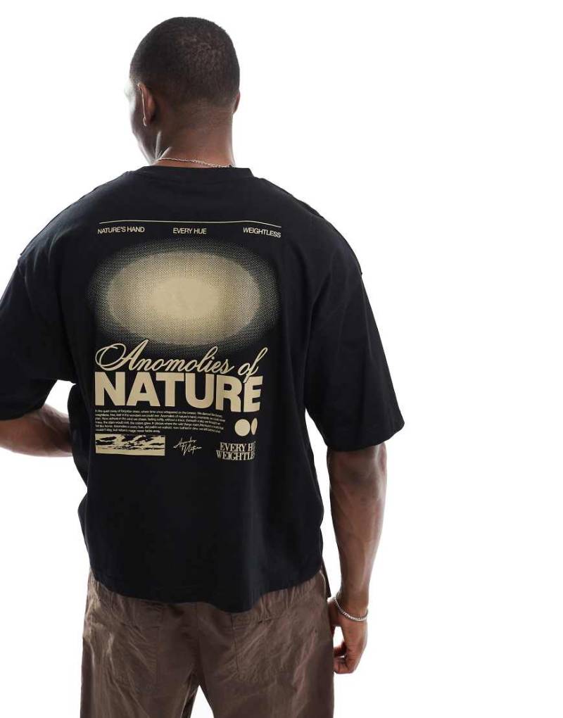 ASOS DESIGN - Kastiges Oversize-T-Shirt in Schwarz mit Himmelskörper-Grafik von ASOS DESIGN