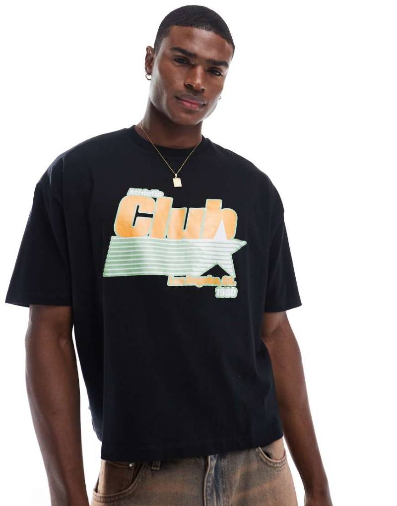 ASOS DESIGN - Kastiges Oversize-T-Shirt in Schwarz mit glitzernder Sport-Grafikprint von ASOS DESIGN