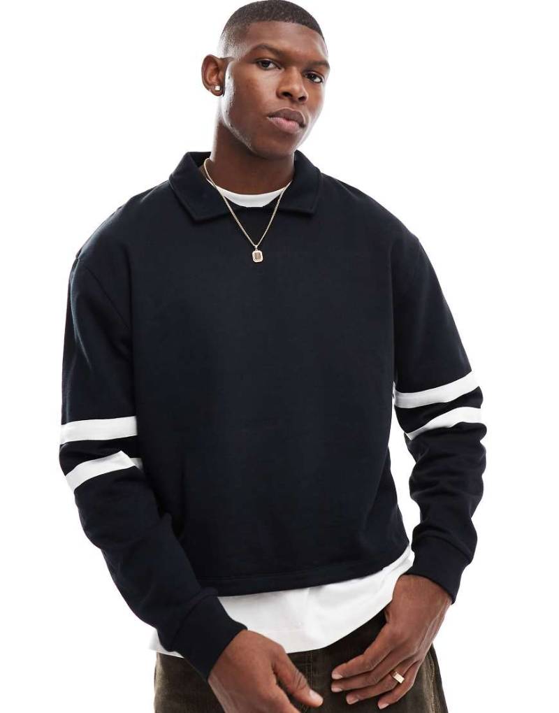 ASOS DESIGN - Kastiges Rugby-Sweatshirt in Schwarz mit Streifen und Oversize-Schnitt von ASOS DESIGN