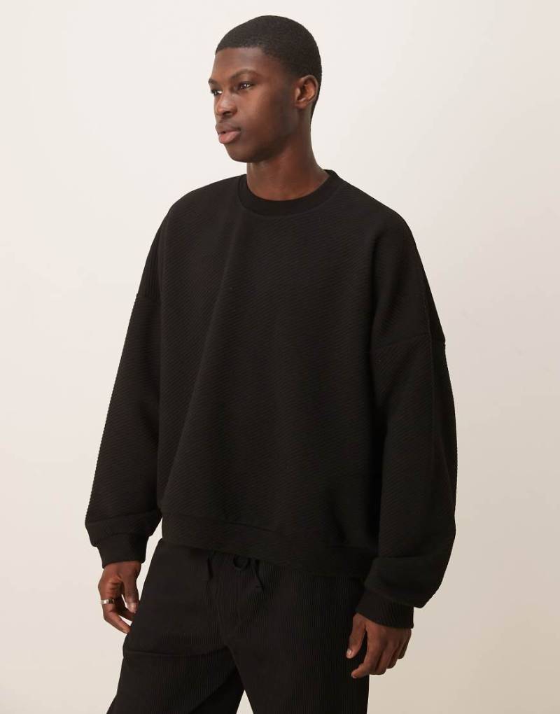ASOS DESIGN - Kastiges Sweatshirt in Schwarz mit ausgeprägter Rippenstruktur in extremer Oversize-Passform-Weiß von ASOS DESIGN