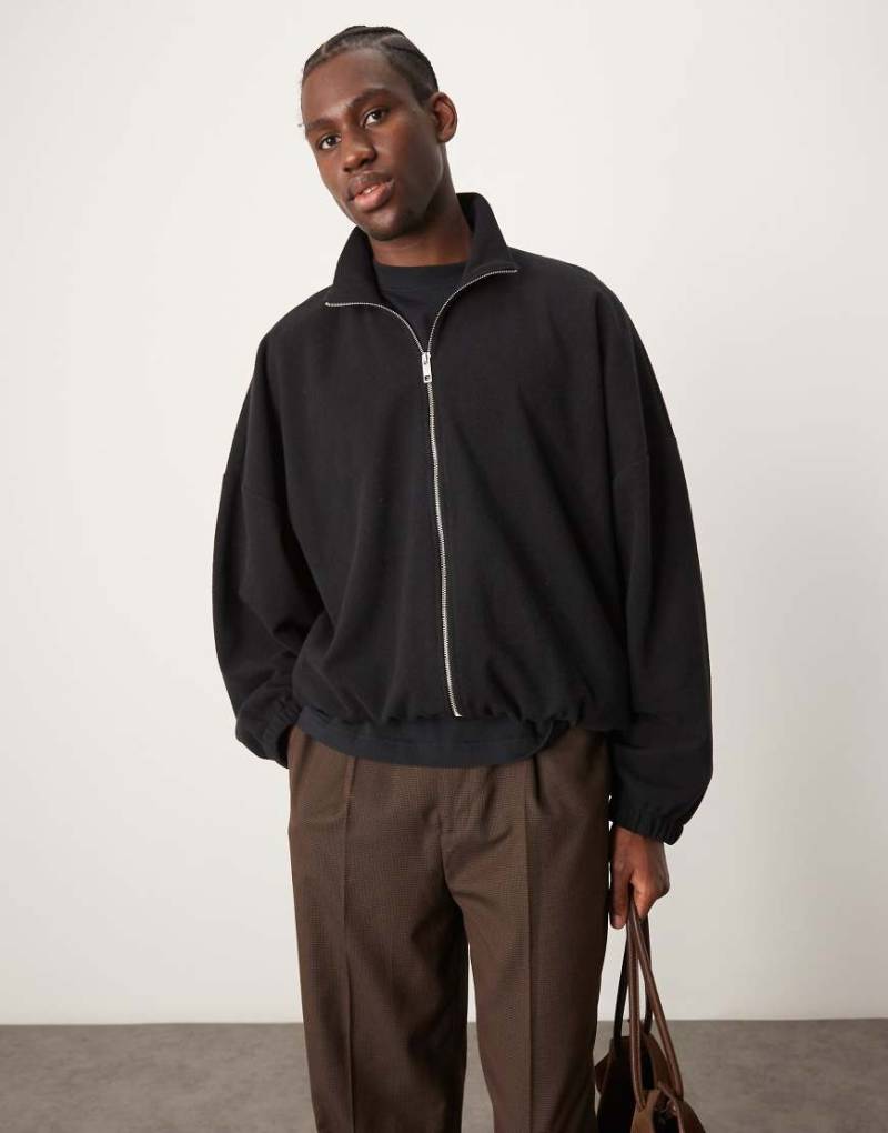 ASOS DESIGN - Kurze Trainingsjacke aus schwerem, gebürstetem Rippstoff in Schwarz mit extremer Oversize-Passform von ASOS DESIGN
