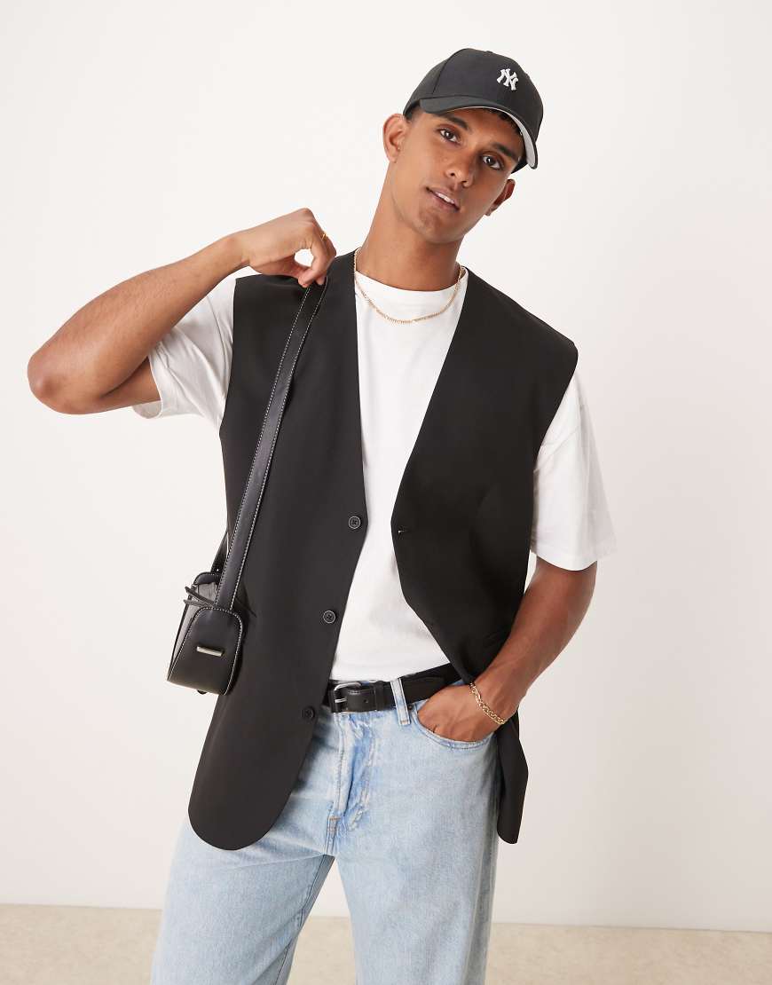 ASOS DESIGN - Lässig geschnittene Longline-Weste in Schwarz von ASOS DESIGN