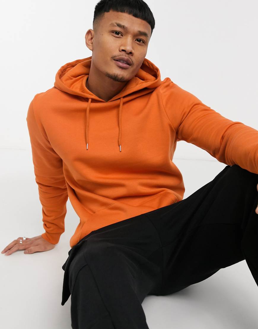 ASOS DESIGN - Lang geschnittener Kapuzenpullover in Orange ASOS DESIGN - Lang geschnittener Kapuzenpullover in Orange von ASOS DESIGN