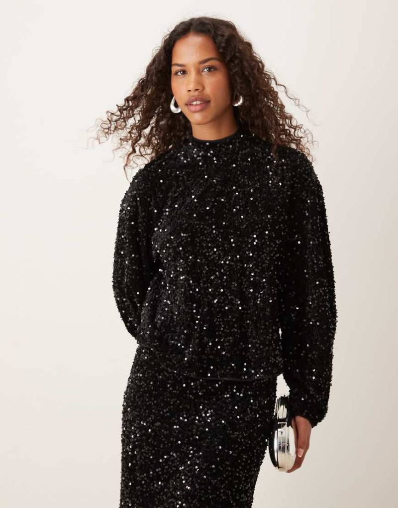 ASOS DESIGN - Langärmlige Samt-Bluse in Schwarz mit Rückenausschnitt und Paillettenbesatz, Kombiteil ASOS DESIGN - Langärmlige Samt-Bluse in Schwarz mit Rückenausschnitt und Paillettenbesatz, Kombiteil von ASOS DESIGN