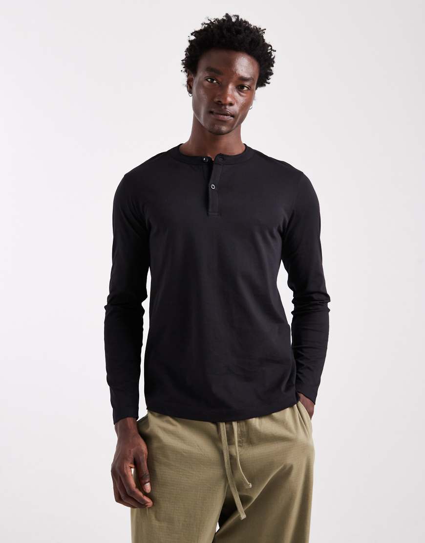 ASOS DESIGN - Langärmliges Henley-T-Shirt in Schwarz ASOS DESIGN - Langärmliges Henley-T-Shirt in Schwarz von ASOS DESIGN