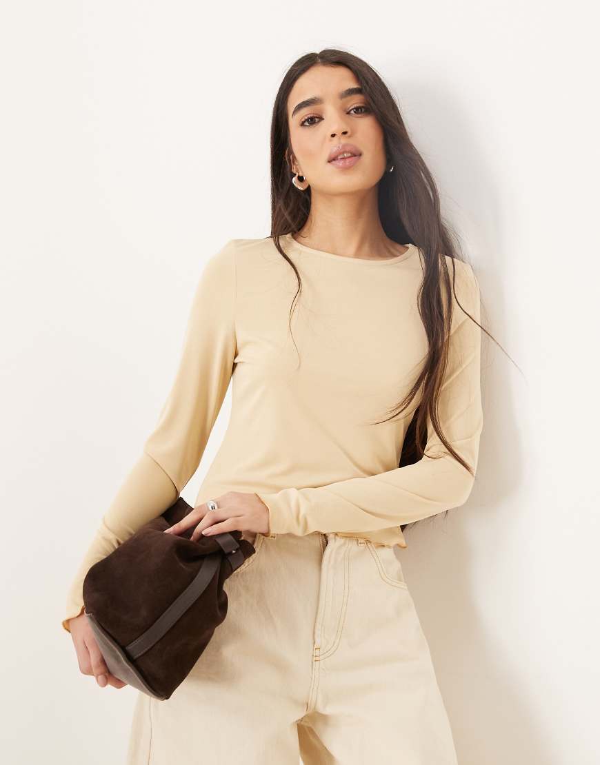 ASOS DESIGN - Langärmliges Modal-Oberteil in Buttermilchgelb mit Kräuselsaum ASOS DESIGN - Langärmliges Modal-Oberteil in Buttermilchgelb mit Kräuselsaum von ASOS DESIGN