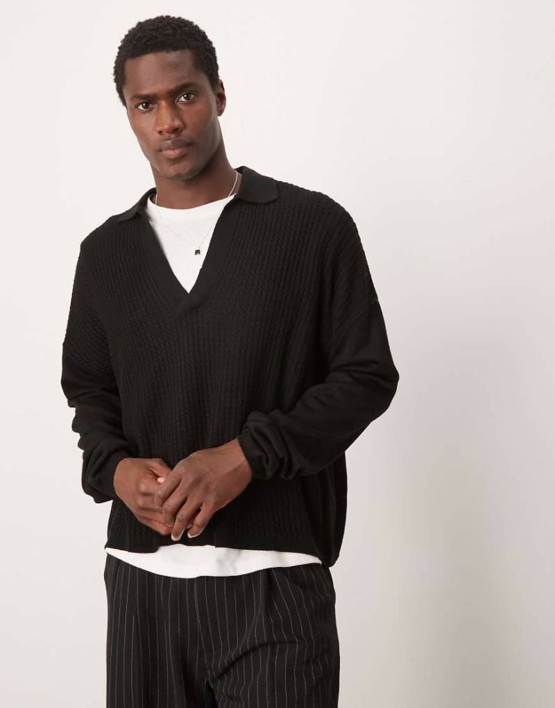 ASOS DESIGN - Langärmliges Oversize-Polohemd aus Strick in Schwarz mit kastigem Schnitt von ASOS DESIGN