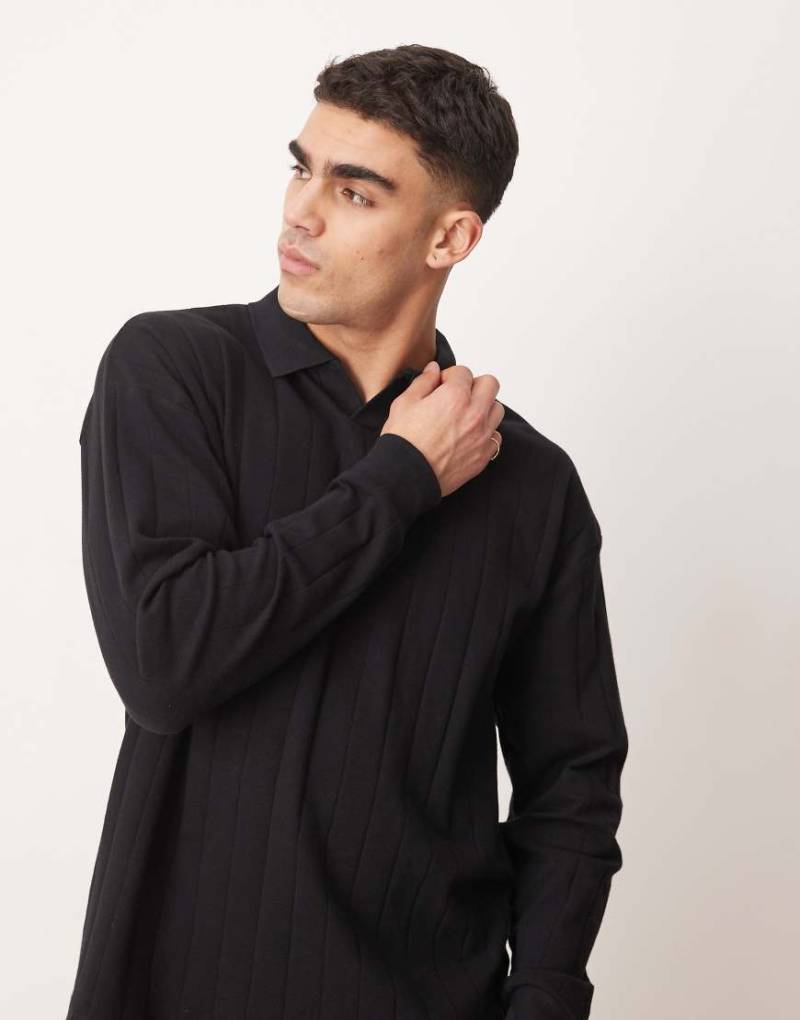 ASOS DESIGN - Langärmliges Oversize-Poloshirt in Schwarz mit Reverskragen und Rippenstruktur von ASOS DESIGN