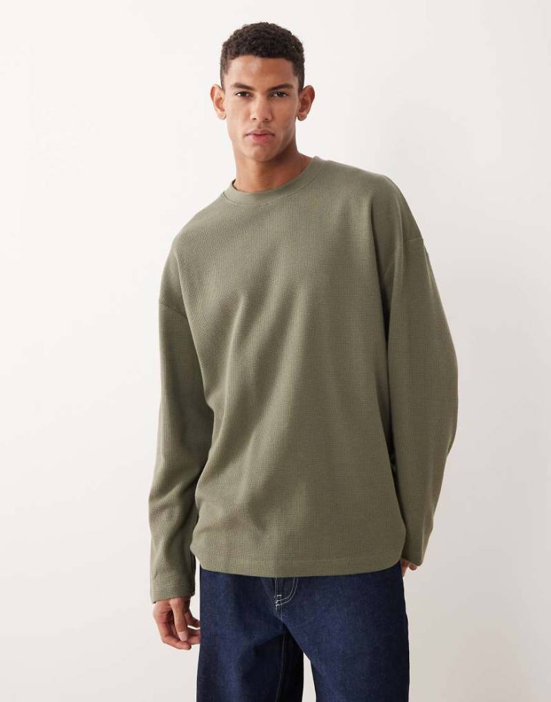 ASOS DESIGN - Langärmliges Oversize-T-Shirt in Khaki mit Waffelstruktur und abfallender Schulterpartie-Grün von ASOS DESIGN