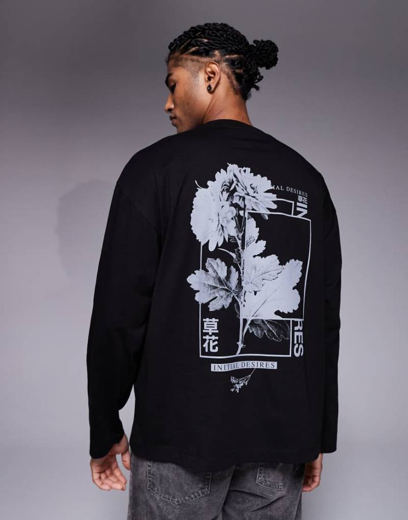 ASOS DESIGN - Langärmliges Oversize-T-Shirt in Schwarz mit Blätter-Grafikmotiv von ASOS DESIGN