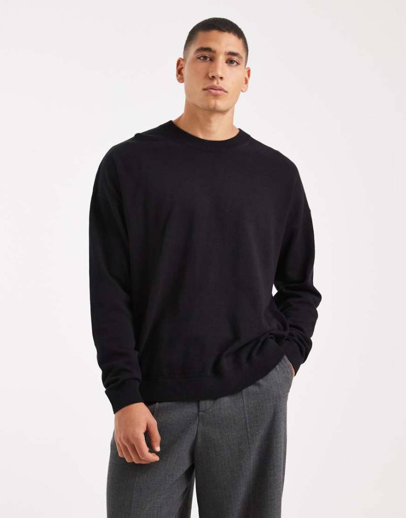 ASOS DESIGN - Langärmliges Relaxed-Fit-T-Shirt mit Rundhalsausschnitt in Schwarz von ASOS DESIGN