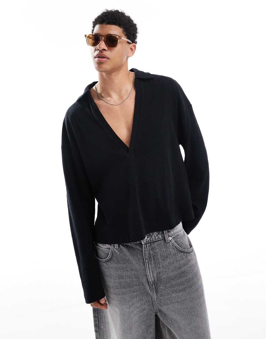 ASOS DESIGN - Langärmliges strukturiertes Oversize-Poloshirt in Schwarz mit tiefem V-Ausschnitt und kastiger Passform von ASOS DESIGN