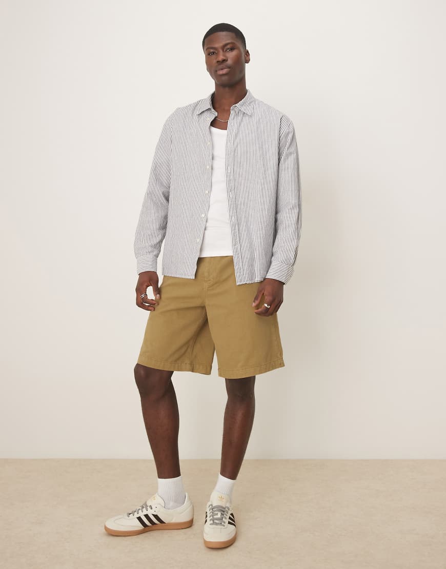 ASOS DESIGN - Lange Shorts in Olivgrün ASOS DESIGN - Lange Shorts in Olivgrün von ASOS DESIGN