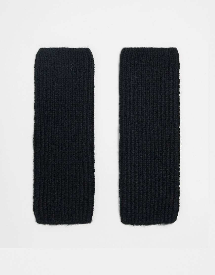 ASOS DESIGN - Lange gestrickte Handstulpen in Schwarz ASOS DESIGN - Lange gestrickte Handstulpen in Schwarz von ASOS DESIGN