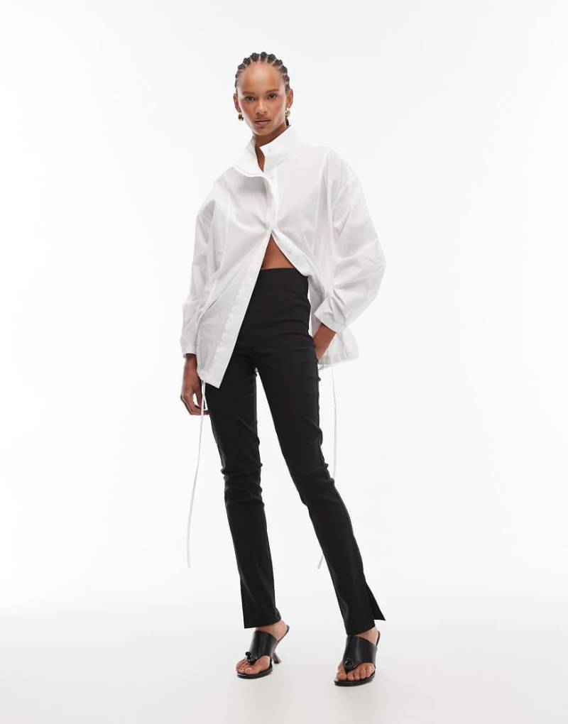 ASOS DESIGN - Leicht verlängerte Bengaline-Leggings in Schwarz mit Seitenschlitz ASOS DESIGN - Leicht verlängerte Bengaline-Leggings in Schwarz mit Seitenschlitz von ASOS DESIGN