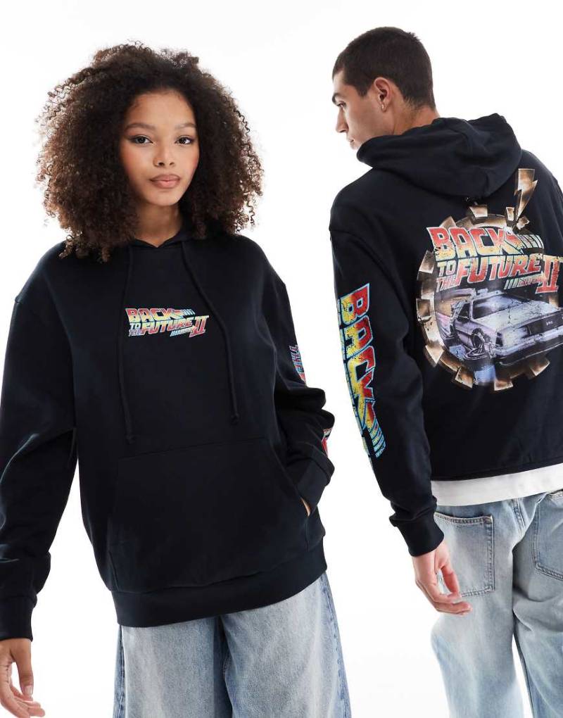 ASOS DESIGN - Lizenzierter Kapuzenpullover in Schwarz mit Oversize-Schnitt und lizenzierten „Back To The Future"-Prints von ASOS DESIGN