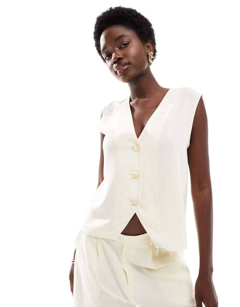 ASOS DESIGN - Locker geschnittene Weste in Buttermilchweiß-Gelb von ASOS DESIGN