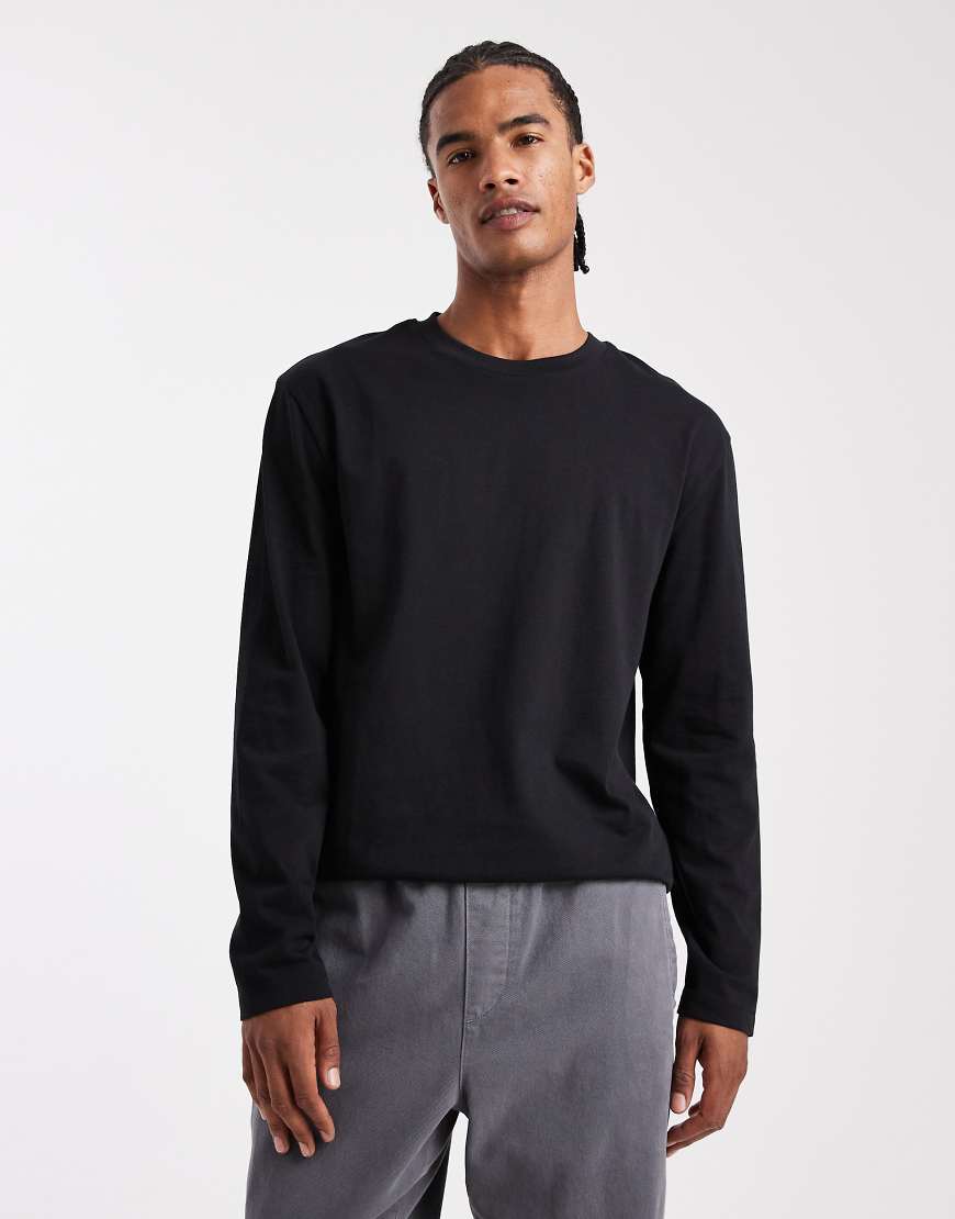 ASOS DESIGN - Locker geschnittenes, langärmliges Shirt aus schwerem Stoff in Schwarz von ASOS DESIGN
