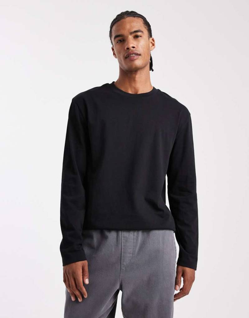 ASOS DESIGN - Locker geschnittenes, langärmliges Shirt aus schwerem Stoff in Schwarz von ASOS DESIGN