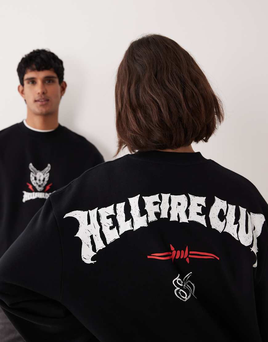 ASOS DESIGN - Locker geschnittenes Unisex-Sweatshirt in Schwarz mit Stranger Things-Grafiken von ASOS DESIGN